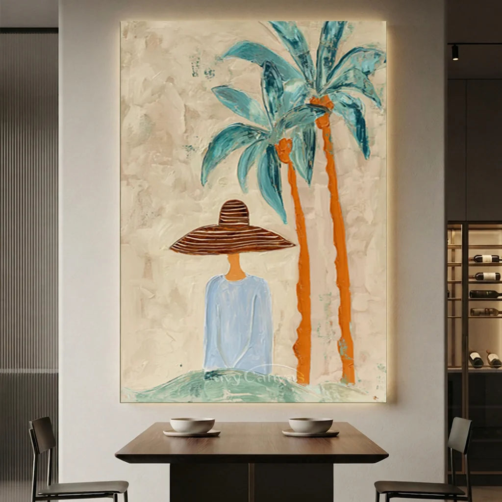 Handcrafted abstract coastal lady oil painting featuring palm trees with rich blue and orange textures hanging in a modern living room or bedroom