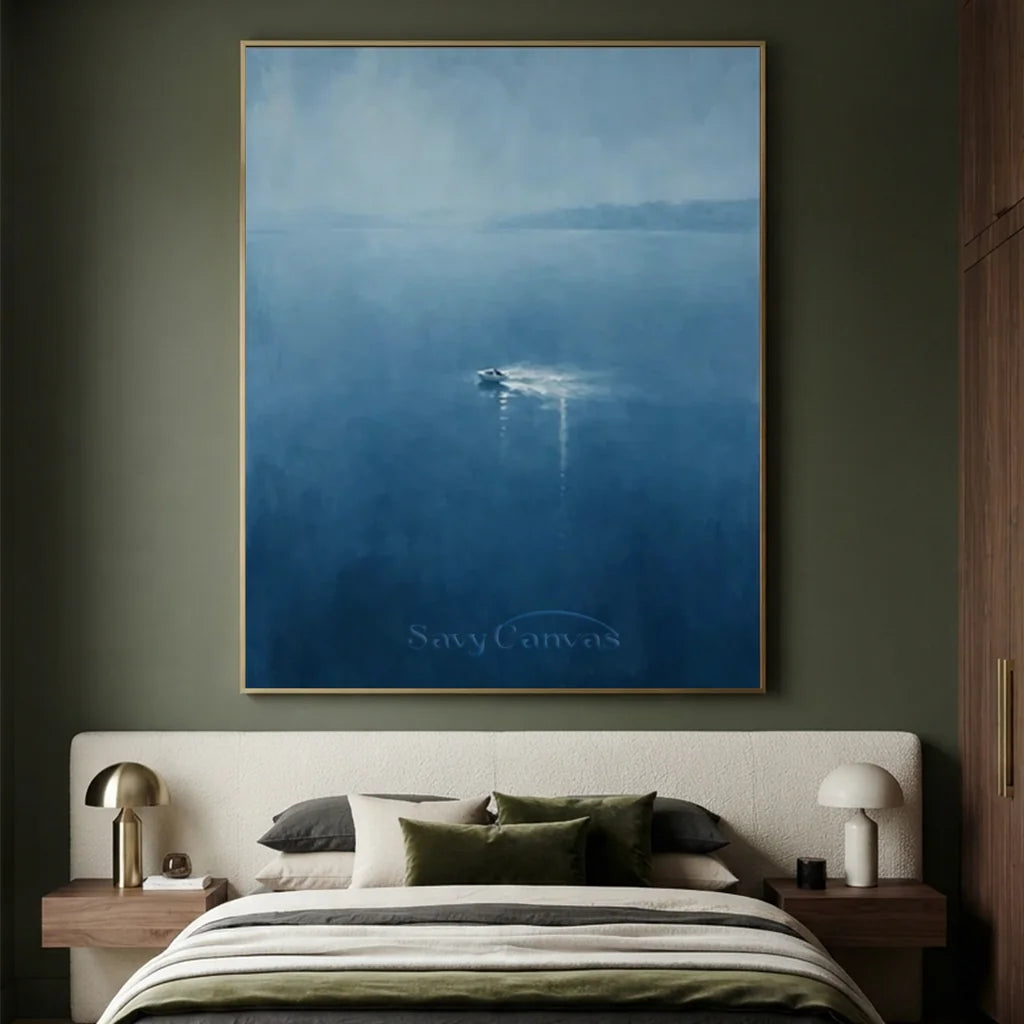 Handmade blue seascape oil painting depicting a solitary boat navigating a calm, deep blue water surface under a misty sky. Features rich hand-painted brush textures in ocean blue and indigo, ideal for modern bedroom and living room wall art decor.