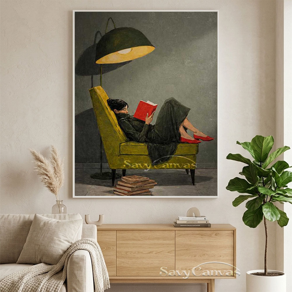 Hand-painted vintage realism oil painting of a woman in a black dress and red shoes reading a book on a green armchair under a glowing floor lamp, displayed in a modern beige living room.
